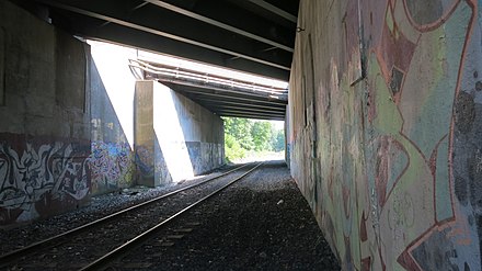 Replete with interesting graffiti, the M&M Trail passes beneath the Mass Pike along with the railroad