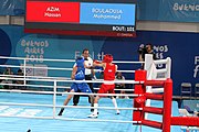 Deutsch: Boxen bei den Olympischen Jugendspielen 2018 Tag 12, 18. Oktober 2018 - Kampf um Bronze im Leichten Weltergewicht Jungen – Hassan Azim (Großbritannien, rot) schlägt Mohammed Boulaouja (Marokko, blau) RSC; Ringrichter ist Wulfren Olivares Peréz (Kolumbien). English: Boxing at the 2018 Summer Youth Olympics on 18 October 2018 – Bronze Medail Match Light Welterweight Boys - Hassan Azim (Great Britain, red) beats Mohammed Boulaouja (Morocco, blue) RSC; Referee is Wulfren Olivares Peréz (Columbia). Español: Boxeo en los Juegos Olímpicos Juveniles de Verano de 2018 en 18 de octubre de 2018 - Medalla de bronce de los hombres ligeros de peso welter: Hassan Azim (Gran Bretaña, rojo) vence a Mohammed Boulaouja (Marruecos, azul) RSC; El árbitro es Wulfren Olivares Peréz (Colombia).