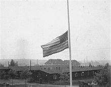 The American flag flying at half-mast in Buchenwald, Thuringia, Nazi Germany, on 19 April 1945 after the death of US President Franklin Roosevelt Buchenwald American Flag 23060.jpg