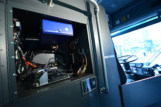 The Bus Time console installed in a bus behind the driver's seat Bus Time Manhattan Launch (10142737816).jpg