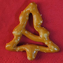 A miniature salted pretzel, shaped like a Christmas tree. Sold in England by Aldi in 2019.