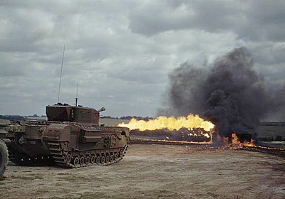 A Churchill tank fitted with a Crocodile flamethrower in action.