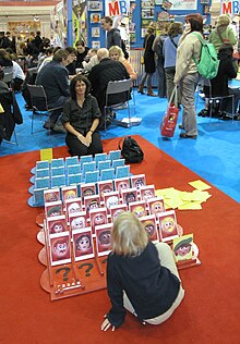 Two people playing Guess Who? at Spiel 2008 Essen08 - Kdo jsem.jpg