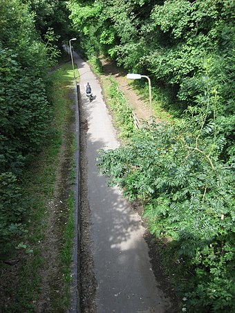 A Redway runs along the disused track bed of the former Wolverton to Newport Pagnell Line.