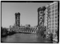 GENERAL VIEW OF LIFT BRIDGE FROM 18TH STREET BRIDGE, LOOKING SOUTHWEST. - Pennsylvania Railroad, South Branch Chicago River Bridge, Spanning South Branch of Chicago River HAER ILL, 16-CHIG, 152-1.tif