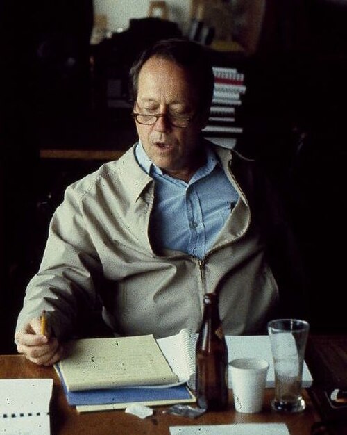 Hill working on a script in 1978
