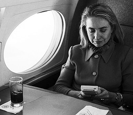 Then first lady Hillary Clinton, plays a GameBoy on a flight in 1993.
