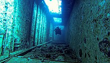 Wreck diver keeping clear of the wreckage while swimming through an fairly confined space Hylkysukellusta.jpg