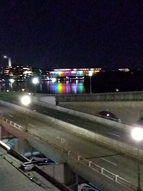 View from Key Bridge. Reflections of Kennedy Center Christmas Lights on the Potomac. Washington Monument