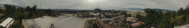 Panoramic photo of Lae city taken from top of the Hodgson Nagi (Telikom) building, Lae. Governors residence to the left. Port to the right. Taken 29 J