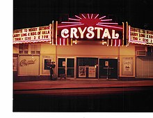 Larry Long standing beneath the Crystal Theatre marquee. Dec. 1, 1988. Larry Long & The Children of Oklahoma.jpg