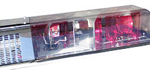 This light bar has a clear dome under which two rotating lights can be seen. A siren speaker can be installed behind the grill Lightbar close-up to see mechanism.jpg