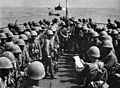 Soldiers of the "Maizuru 1st Special Naval Landing Force" are addressed by an officer before the invasion of Hainan, China, 1939.