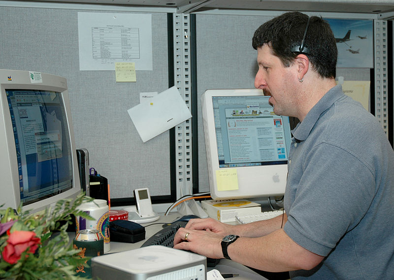 File:Man responds to telephone call.jpg