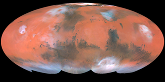 Mollweide projection of albedo features on Mars from Hubble Space Telescope. Bright ochre areas in left, center, and right are Tharsis, Arabia, and Elysium, respectively. The dark region at top center left is Acidalium Planitia. Syrtis Major is the dark area projecting upward in the center right. Note orographic clouds over Olympus and Elysium Montes (left and right, respectively). Mars HST Mollweide map 1999.png