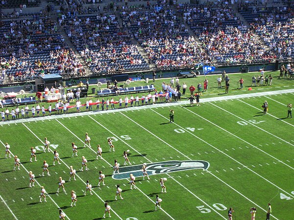 Sea Gals cheerleaders perform before the game