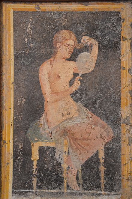 Roman fresco of a woman fixing her hair using a mirror, from Stabiae, Italy, 1st century AD