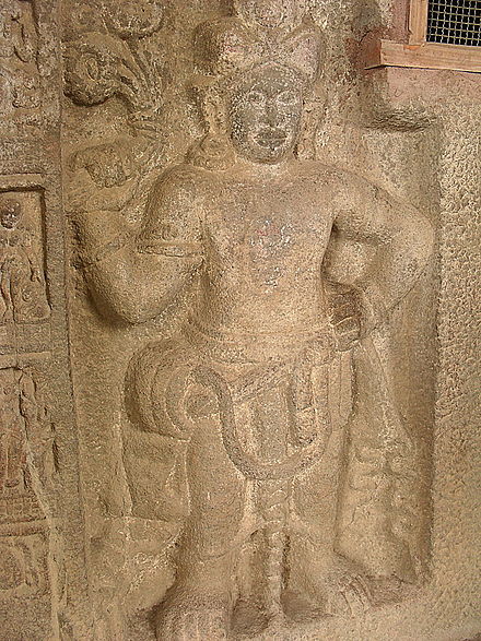 A close up of a figure from the Buddhist canon
