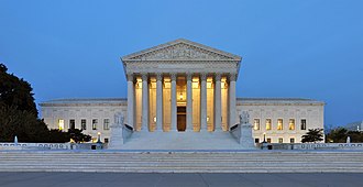 The present U.S. Supreme Court building as viewed from the front Panorama of United States Supreme Court Building at Dusk.jpg
