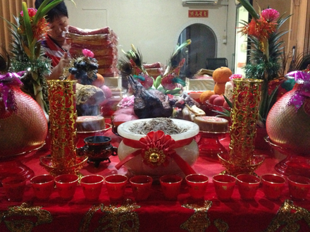 One of the locals prepares materials for the Jade Emperor Festival