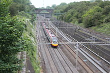 Quadruple track section of line at Roade cutting in Northamptonshire - lines have already divided south of here and diverge a little further north Roade cutting.JPG