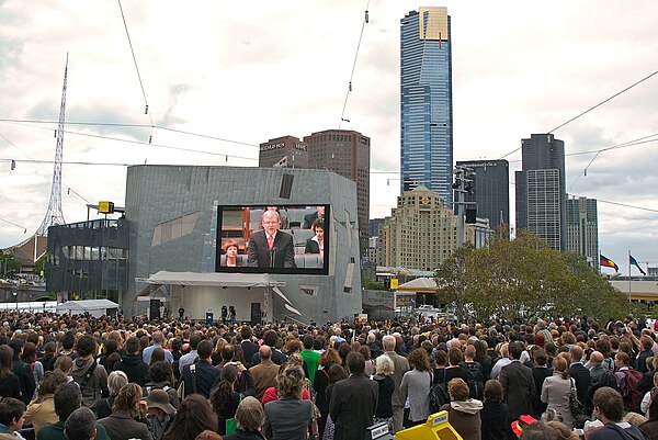 Kevin Rudd on screen in Federation Square, Melbourne, apologising to the stolen generations.