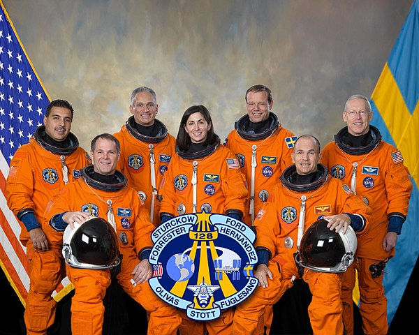 Seated (l–r) Ford and Sturckow. Standing (l–r) are Hernández, Olivas, Stott, Fuglesang and Forrester.Space Shuttle program← STS-127STS-129 →