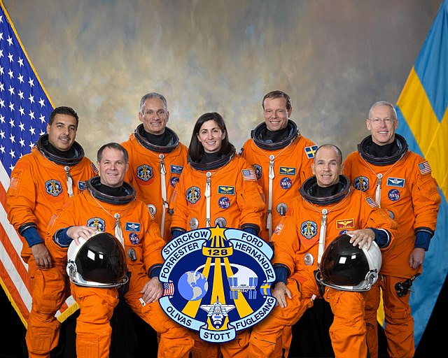 Seated (l–r) Ford and Sturckow. Standing (l–r) are Hernández, Olivas, Stott, Fuglesang and Forrester.Space Shuttle program← STS-127STS-129 →