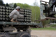 Loading artillery shells (2016) Saber Junction 15 150426-A-QC664-003.jpg