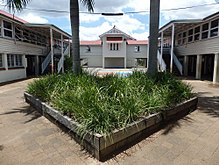 Sectional school buildings, from left to right: Block D, Block C, Block E, 2016 Sectional School Buildings - Block C, centre; Block D, left; and Block E, right; view from west (EHP, 2016).jpg