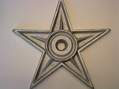 My wife, bless her soul, presented me with my very own barnstar. On a recent trip to Kansas, she found it at an antique store, and bought it for me. Isn't she sweet?