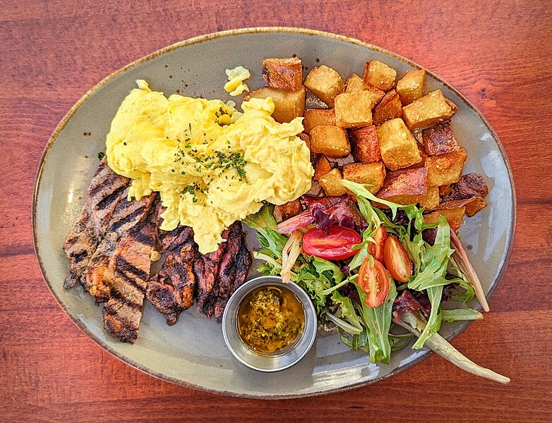 File:Skirt steak with chimichurri sauce, scrambled eggs, potatoes, and a salad - San Francisco, CA.jpg