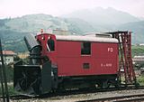 Snøfreser på togvogn på den tidligere, smalsporede jernbanen Furka-Oberalp-Bahn i Disentis/Mustér i Sveits.