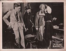 Lobby card for the film. The-village-blacksmith-lobbycard-1922.jpeg