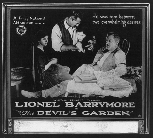 Lionel and first wife Doris (in rocking chair) in the 1920 silent film The Devil's Garden.