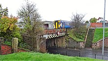A train bound for Kilmarnock passes through Bonnyton at Bonnyton Road Train for Kilmarnock on the Burns Line at Bonnyton Road, East Ayrshire.jpg