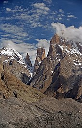 The Trango Towers in Pakistan. Their vertical faces are the world's tallest cliffs. Trango Tower center; Trango Monk center left; Trango II far left; Great Trango right. Trango Towers 2.jpg