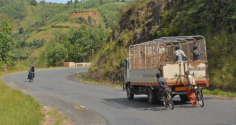 File:Truck and bicylists near Gitega, Burundi.jpg