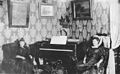 Two women seated next to piano in Esther Duffy's house, ca 1898 (HEGG 66).jpeg