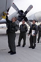 US Navy 040204-N-3122S-002 Aviation Machinist Mate 1st Class Frederick Berger signs a U.S