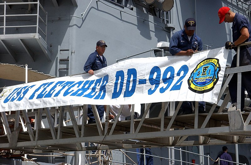 File:US Navy 040525-N-3019M-003 Sailors assigned to the Spruance Class destroyer USS Fletcher (DD 992) attach the ship's banner to the brow after returning to Pearl Harbor for a two-day port visit.jpg