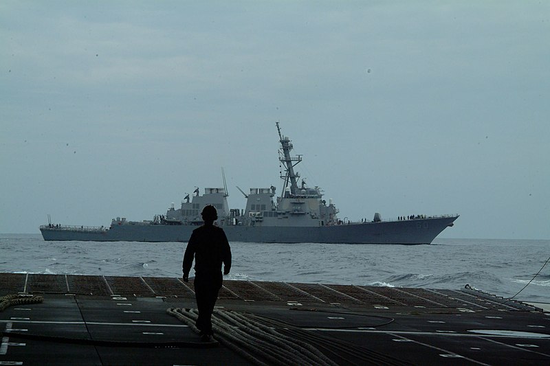 File:US Navy 050814-N-4772B-245 A Sailor walks in the well deck of the amphibious dock landing ship USS Harpers Ferry (LSD 49) checking lines just before a towing exercise.jpg