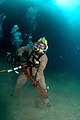 US Navy 080726-N-3093M-007 Chief Warrant Officer Guy Inzunza carries a pipe wrench across the seabed during a dive from the Military Sealift Command rescue and salvage ship USNS Grasp (ARS 51).jpg