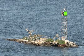 tiny island with metal structure on it