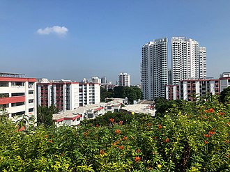 High density public housing in Singapore, which are a common sight in the country, consists of different ethnic groups living together. Woodlands Town Park East, Singapore, looking north towards Marsiling Rise.jpg