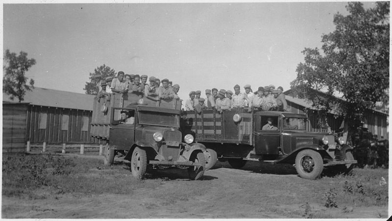 File:Work crews loaded into trucks - NARA - 285721.jpg