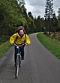 Yellow cyclist bicycling down the Vennbahnweg in Raeren, Belgium (DSCF5866).jpg