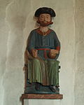 Treskulpturen av Olav den hellige i kirken i Åre i Sverige framstiller middelalderkongen med karolinsk trekanthatt. En teori er at den opprinnelige, forgylte krona ble stjålet og erstattet med et like «kongelig» hodeplagg som det Karl 12. bar.[1]