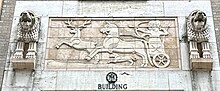 Terra-cotta panel depicting a hunting scene 130 West 30th Street, Terra Cotta Panel.jpg