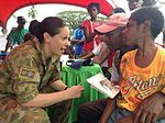 Thumbnail for File:3 AME Squadron member with PNG citizens in 2013.jpg